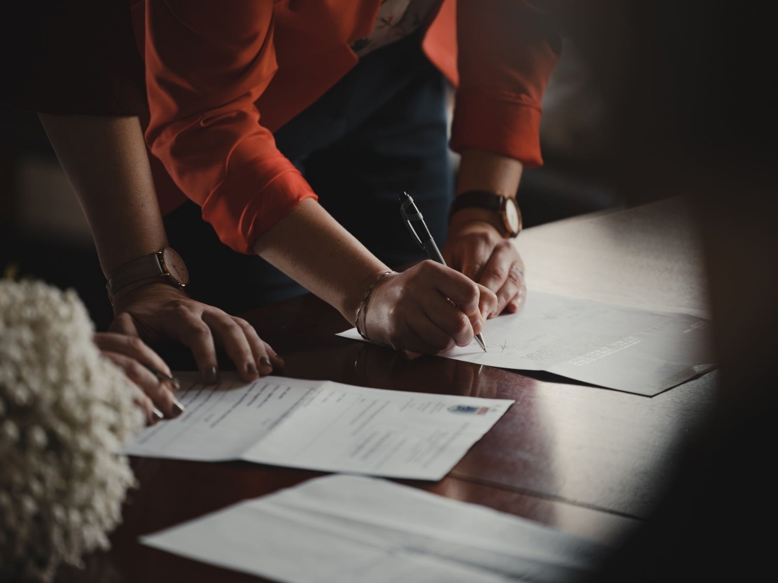 Two employees reviewing a franchise disclosure document