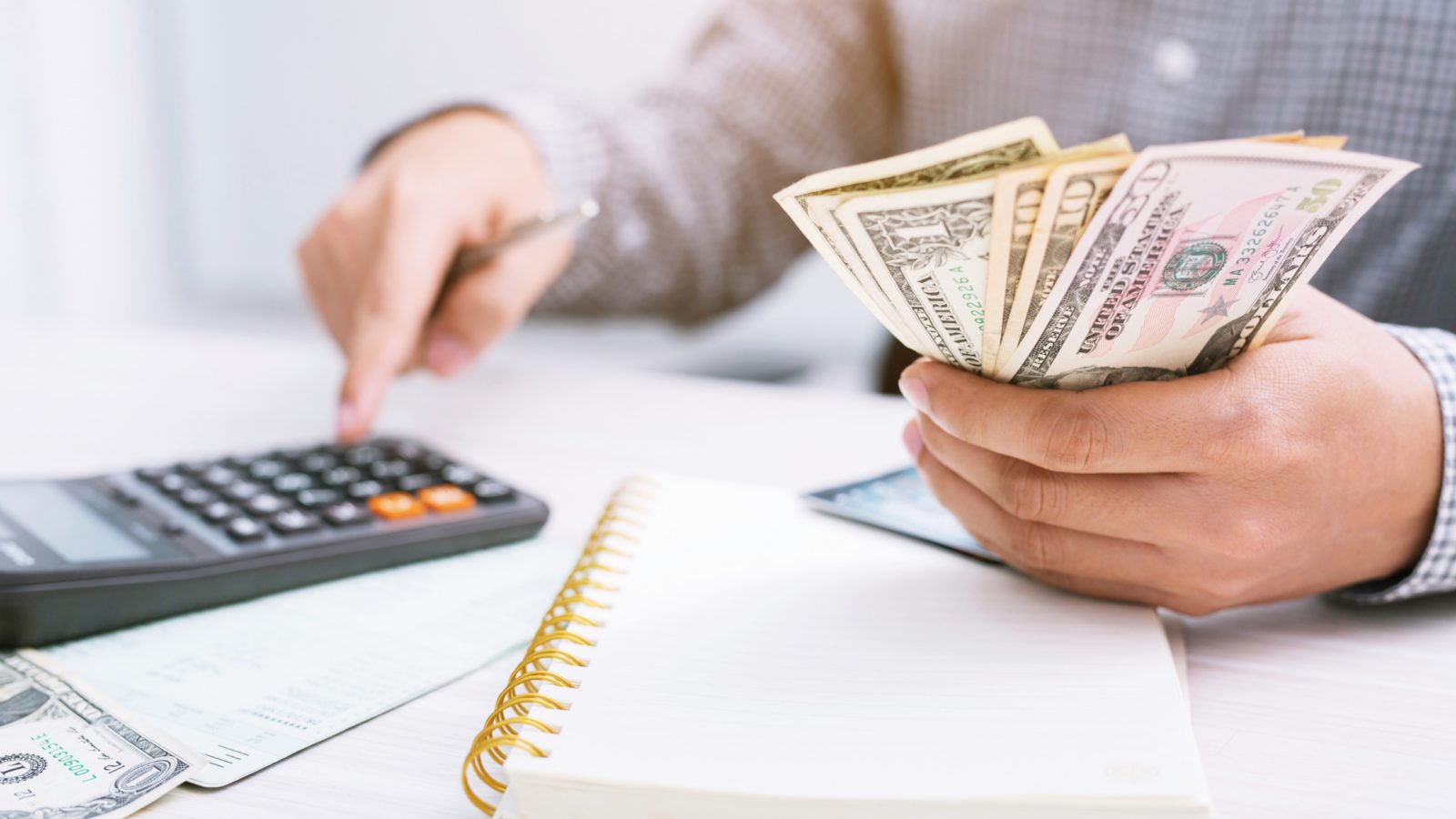 business person calculating payroll data